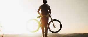 Preview wallpaper guy, bike, sun, mountains, active