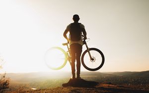 Preview wallpaper guy, bike, sun, mountains, active