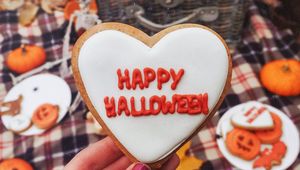 Preview wallpaper halloween, cookies, hand, picnic