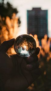 Preview wallpaper hand, ball, glass, reflection, blur