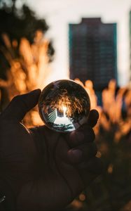 Preview wallpaper hand, ball, glass, reflection, blur