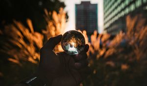 Preview wallpaper hand, ball, glass, reflection, blur