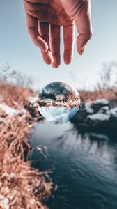 Preview wallpaper hand, ball, glass, transparent, winter, snow