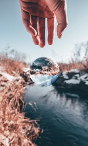 Preview wallpaper hand, ball, glass, transparent, winter, snow
