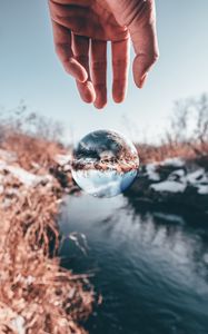 Preview wallpaper hand, ball, glass, transparent, winter, snow