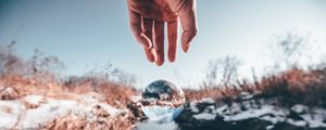 Preview wallpaper hand, ball, glass, transparent, winter, snow