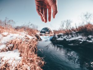 Preview wallpaper hand, ball, glass, transparent, winter, snow