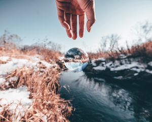 Preview wallpaper hand, ball, glass, transparent, winter, snow