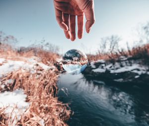 Preview wallpaper hand, ball, glass, transparent, winter, snow