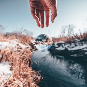 Preview wallpaper hand, ball, glass, transparent, winter, snow