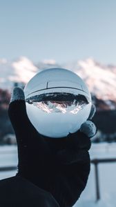 Preview wallpaper hand, ball, glass, mountains, optical illusion
