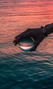 Preview wallpaper hand, ball, glass, reflection, water, waves