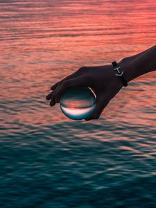 Preview wallpaper hand, ball, glass, reflection, water, waves