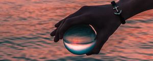 Preview wallpaper hand, ball, glass, reflection, water, waves