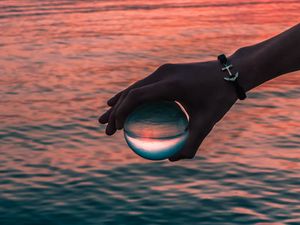 Preview wallpaper hand, ball, glass, reflection, water, waves