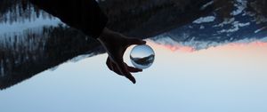 Preview wallpaper hand, ball, reflection, mountains