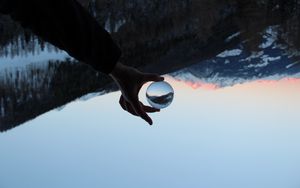 Preview wallpaper hand, ball, reflection, mountains