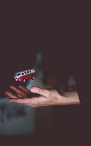 Preview wallpaper hand, bus, toss, volkswagen, model, toy