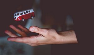 Preview wallpaper hand, bus, toss, volkswagen, model, toy