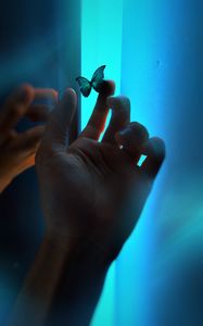 Preview wallpaper hand, butterfly, neon, fingers, glow, blue