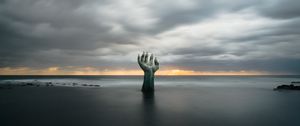 Preview wallpaper hand, coast, sand, clouds, wet