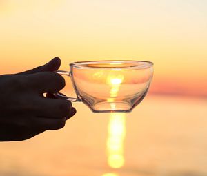Preview wallpaper hand, cup, sunset, sun