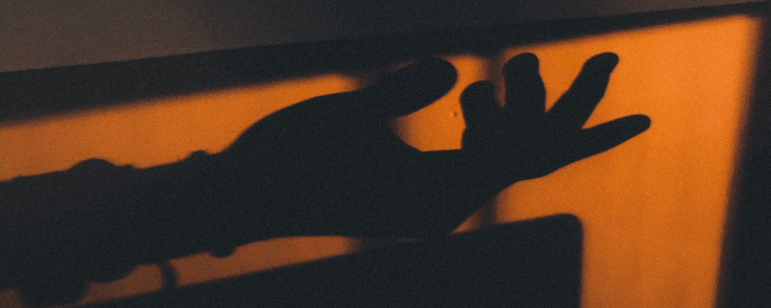 Download wallpaper 2560x1024 hand, shadow, dark ultrawide monitor hd