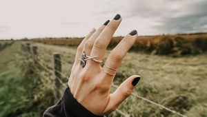 Preview wallpaper hand, fingers, rings, decoration, manicure, field, fence