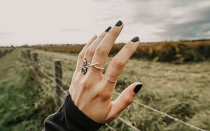 Preview wallpaper hand, fingers, rings, decoration, manicure, field, fence
