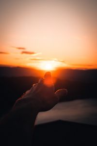 Preview wallpaper hand, fingers, sunset, light, glare