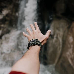 Preview wallpaper hand, fingers, wrist watches, waterfall