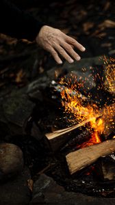 Preview wallpaper hand, fire, sparks, bonfire