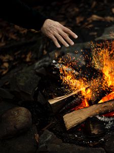 Preview wallpaper hand, fire, sparks, bonfire