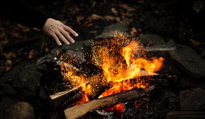 Preview wallpaper hand, fire, sparks, bonfire