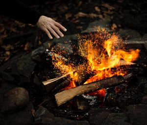 Preview wallpaper hand, fire, sparks, bonfire