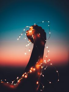 Preview wallpaper hand, garland, bulbs, light, night