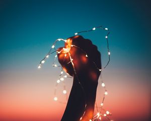 Preview wallpaper hand, garland, bulbs, light, night