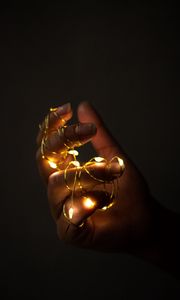 Preview wallpaper hand, garland, fingers, dark, glow