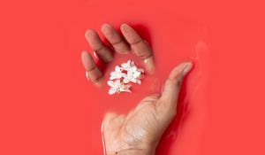 Preview wallpaper hand, liquid, flowers, red