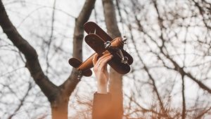 Preview wallpaper hand, plane, toy, trees, branches