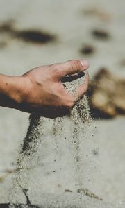 Preview wallpaper hand, sand, pour, beach