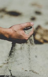 Preview wallpaper hand, sand, pour, beach