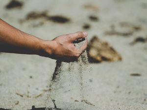 Preview wallpaper hand, sand, pour, beach