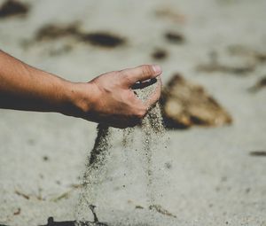 Preview wallpaper hand, sand, pour, beach