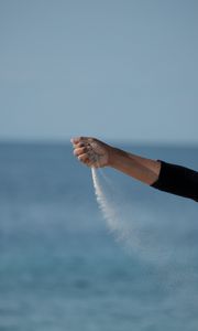 Preview wallpaper hand, sand, sea, wind