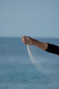 Preview wallpaper hand, sand, sea, wind