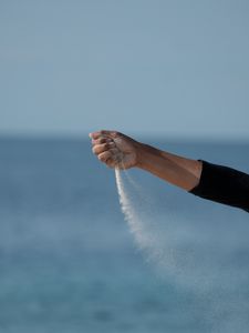 Preview wallpaper hand, sand, sea, wind