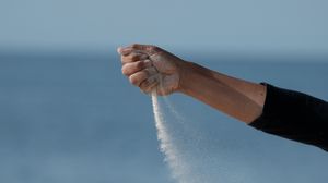 Preview wallpaper hand, sand, sea, wind