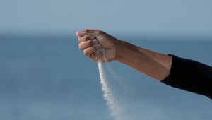 Preview wallpaper hand, sand, sea, wind