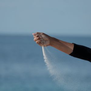 Preview wallpaper hand, sand, sea, wind